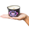 Kama Sutra Massage Oil Candle in hand
