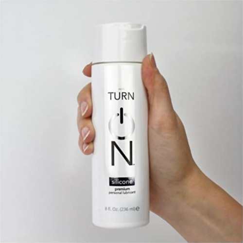Turn On Silicone Based Personal Lubricant 8 oz in hand